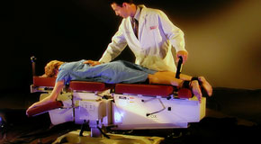 This is a picture of Cox Technic chiropratic spinal manipulation as performed at Amelia Chiropractic Clinic.